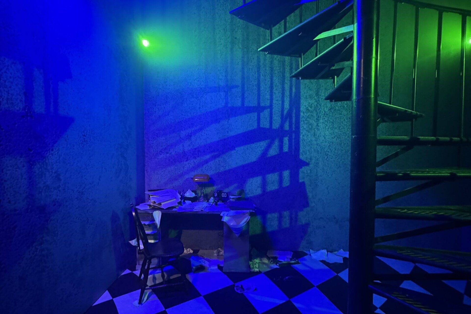 Blue and green lit attic room with striped Netherworld detailing