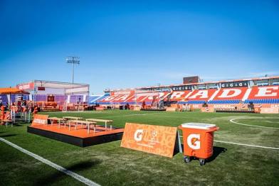 Pitchside Gatorade branding, coolers and stage build ahead of match day